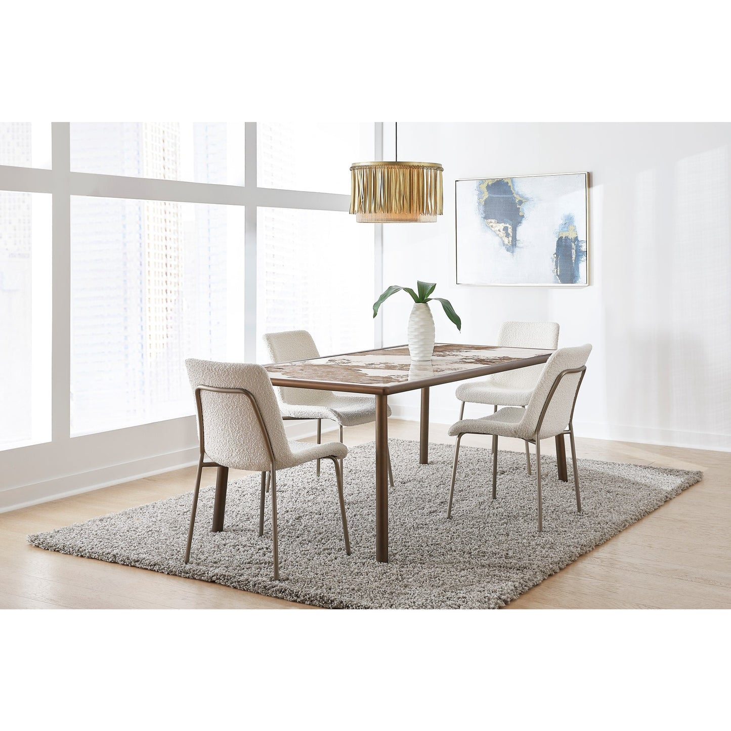 Tavolo da pranzo con piano in pietra Tulum e base in metallo bronzo