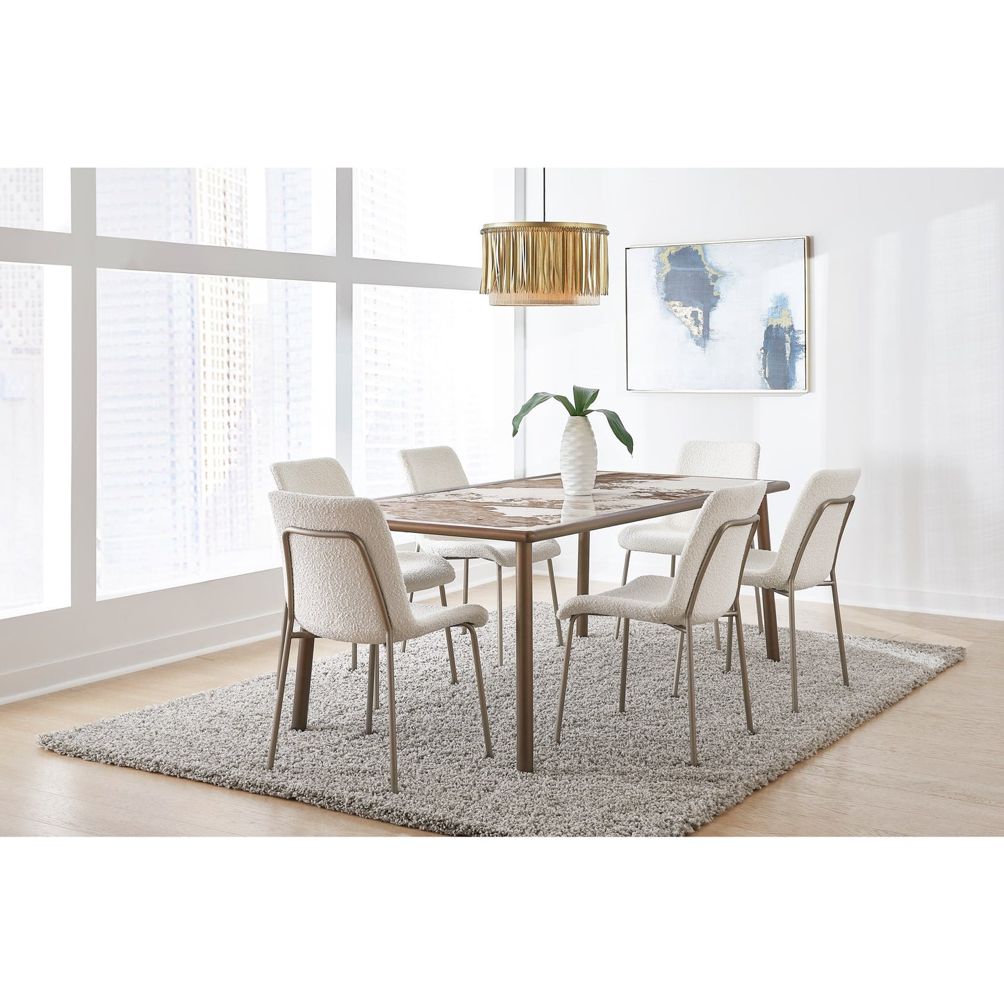 Tavolo da pranzo con piano in pietra Tulum e base in metallo bronzo
