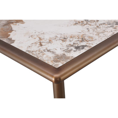 Tavolo da pranzo con piano in pietra Tulum e base in metallo bronzo